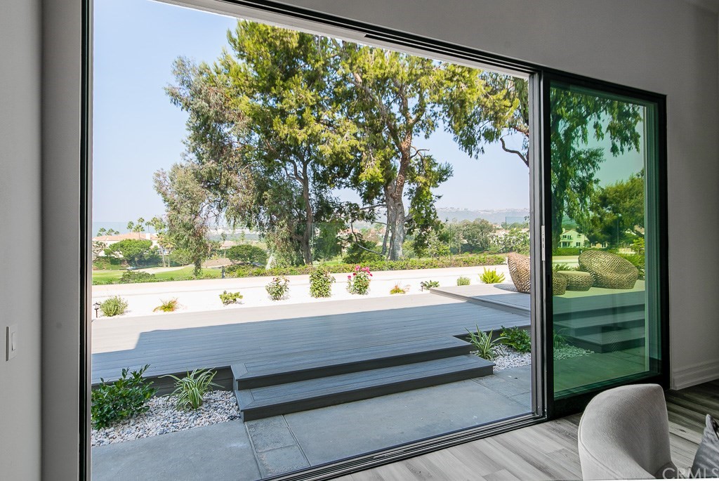 11 Marbella Dana Point, CA 92629 - Photo 31 of 50 a view of a floor to ceiling window and a yard