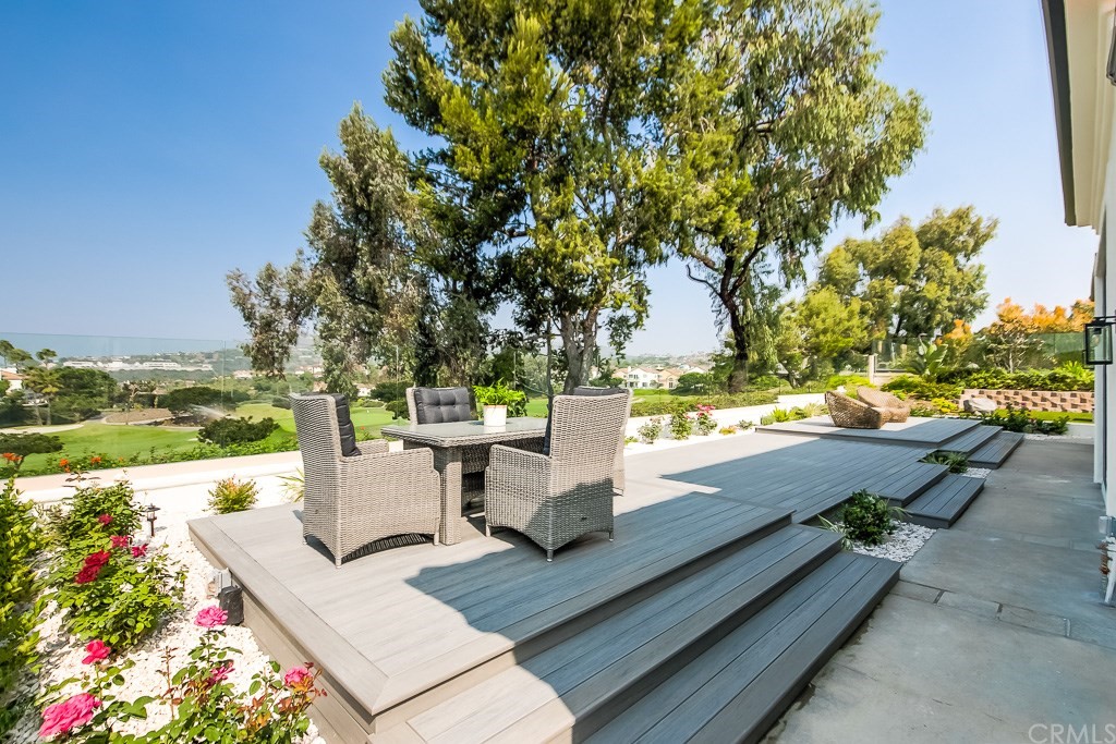 11 Marbella Dana Point, CA 92629 - Photo 32 of 50 a view of a patio with dining table and chairs and a fire pit