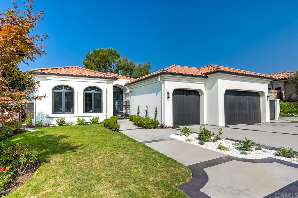 11 Marbella Dana Point, CA 92629 - Photo 46 of 50 a front view of a house with a garden and yard