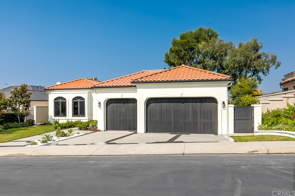 11 Marbella Dana Point, CA 92629 - Photo 50 of 50 a front view of a house with a yard and garage