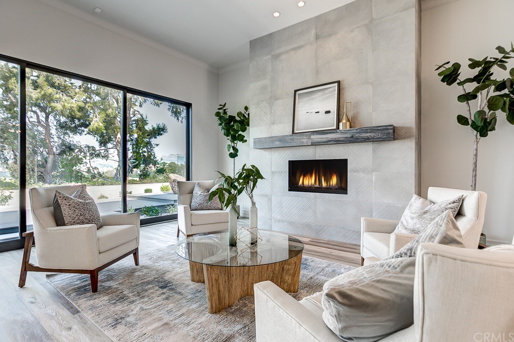 11 Marbella Dana Point, CA 92629 - Photo 5 of 50 a living room with furniture fireplace and potted plant