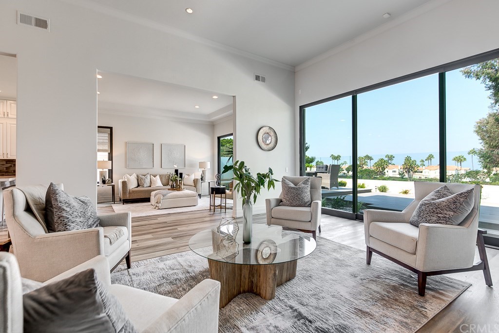 11 Marbella Dana Point, CA 92629 - Photo 6 of 50 a living room with fireplace furniture and a large window