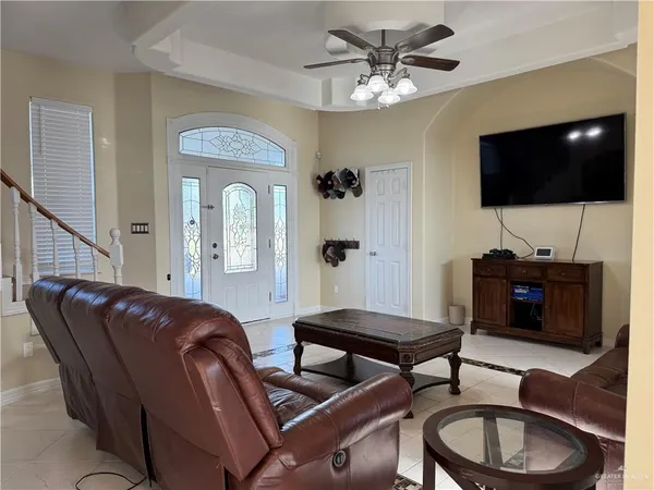 a living room with furniture and a flat screen tv