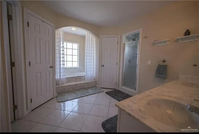 a view of a bathroom with a sink and a vanity