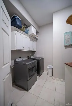a view of a stove top oven and cabinets