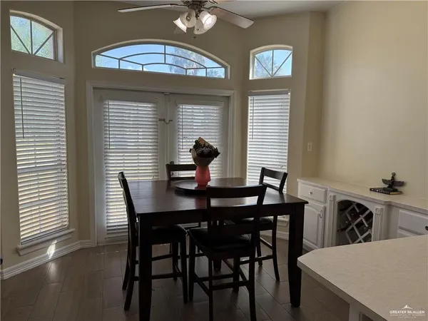 a view of a dining room with furniture and window