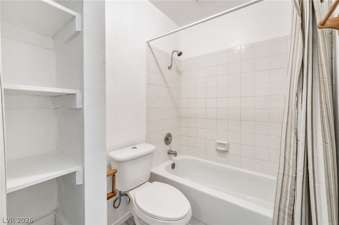 242 Nebraska Avenue Henderson, NV 89015 - Photo 20 of 46 Full bath featuring toilet and shower / bathtub combination with curtain