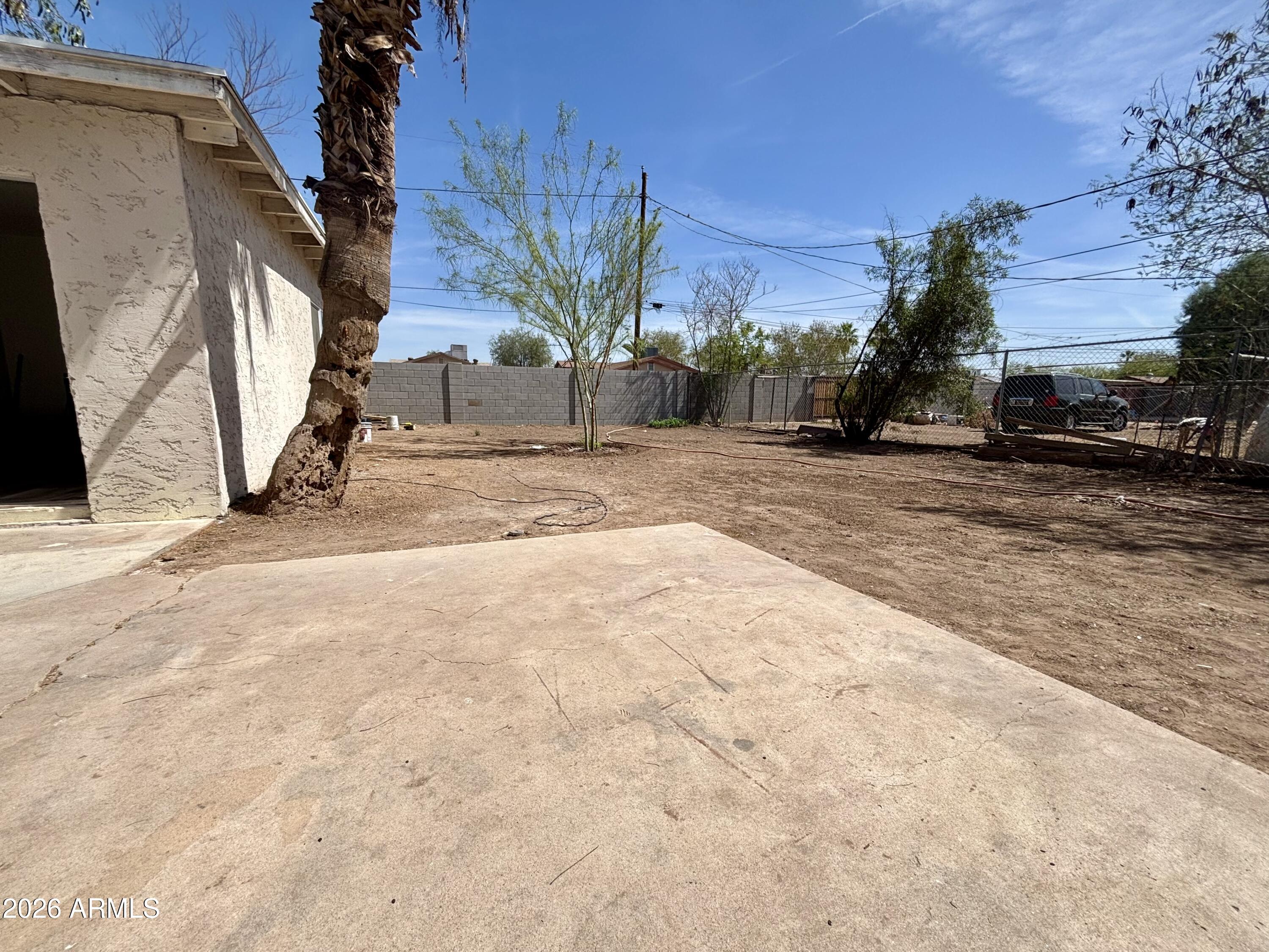 3036 West Almeria Road Phoenix, AZ 85009 - Photo 19 of 20 a view of a street with a building in the background