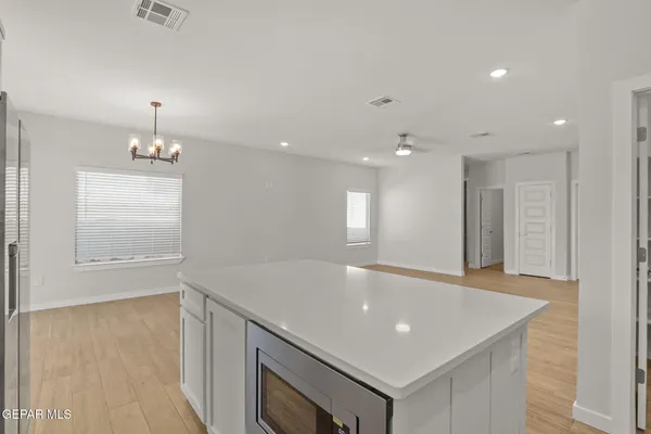 a room with pool table and windows