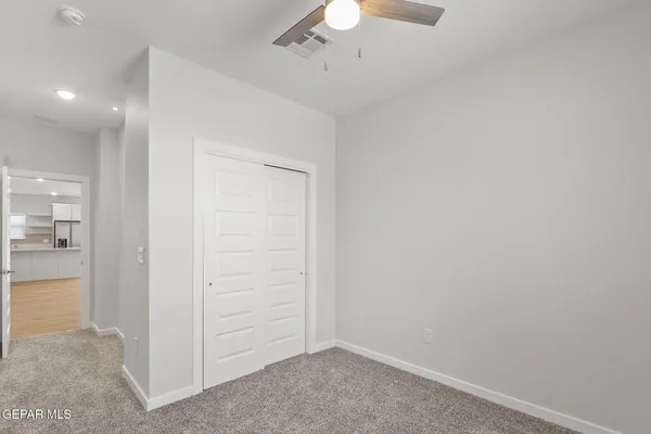 an empty room with a hallway