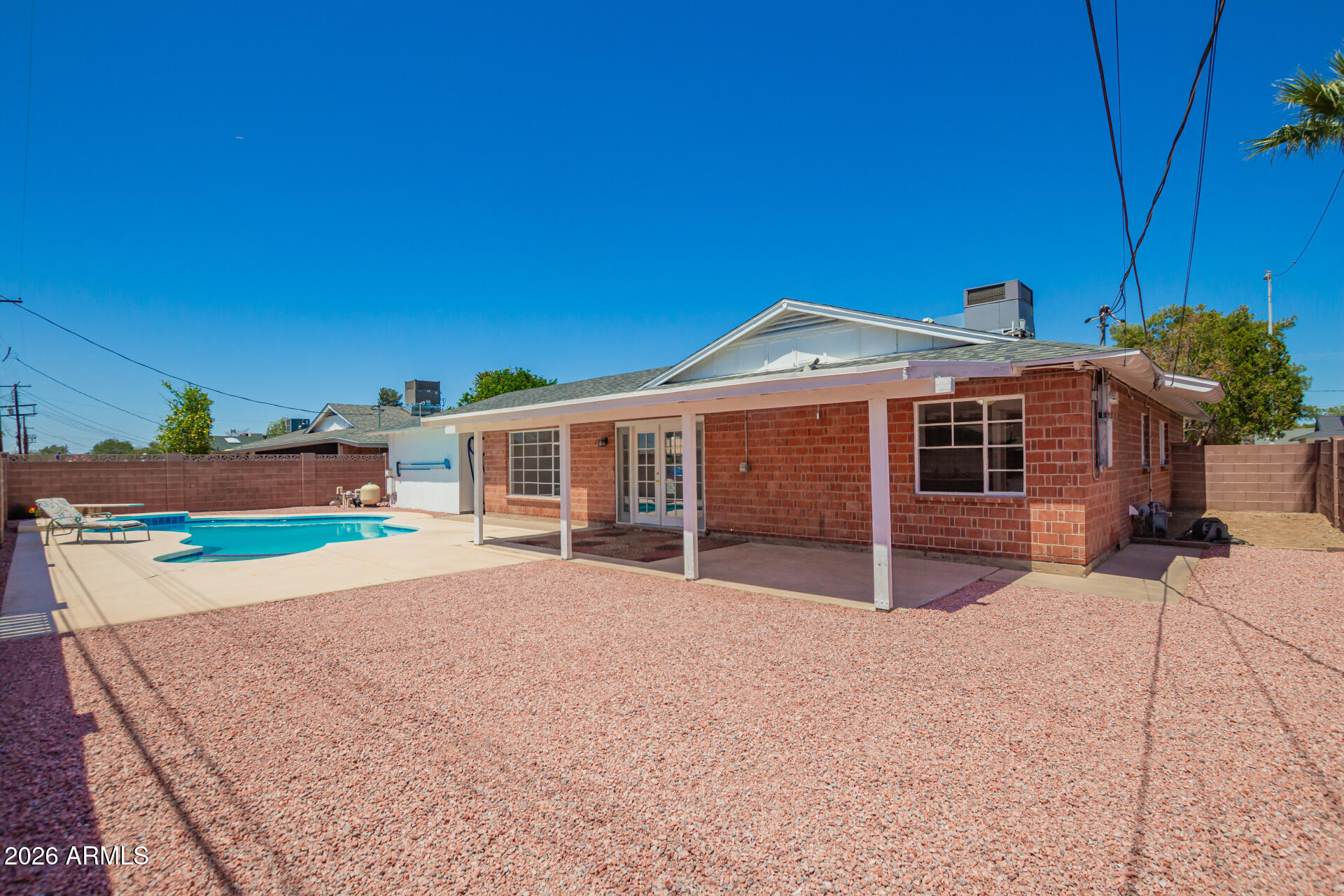 3913 West Krall Street Phoenix, AZ 85019 - Photo 28 of 35 a front view of a house with a yard and garage