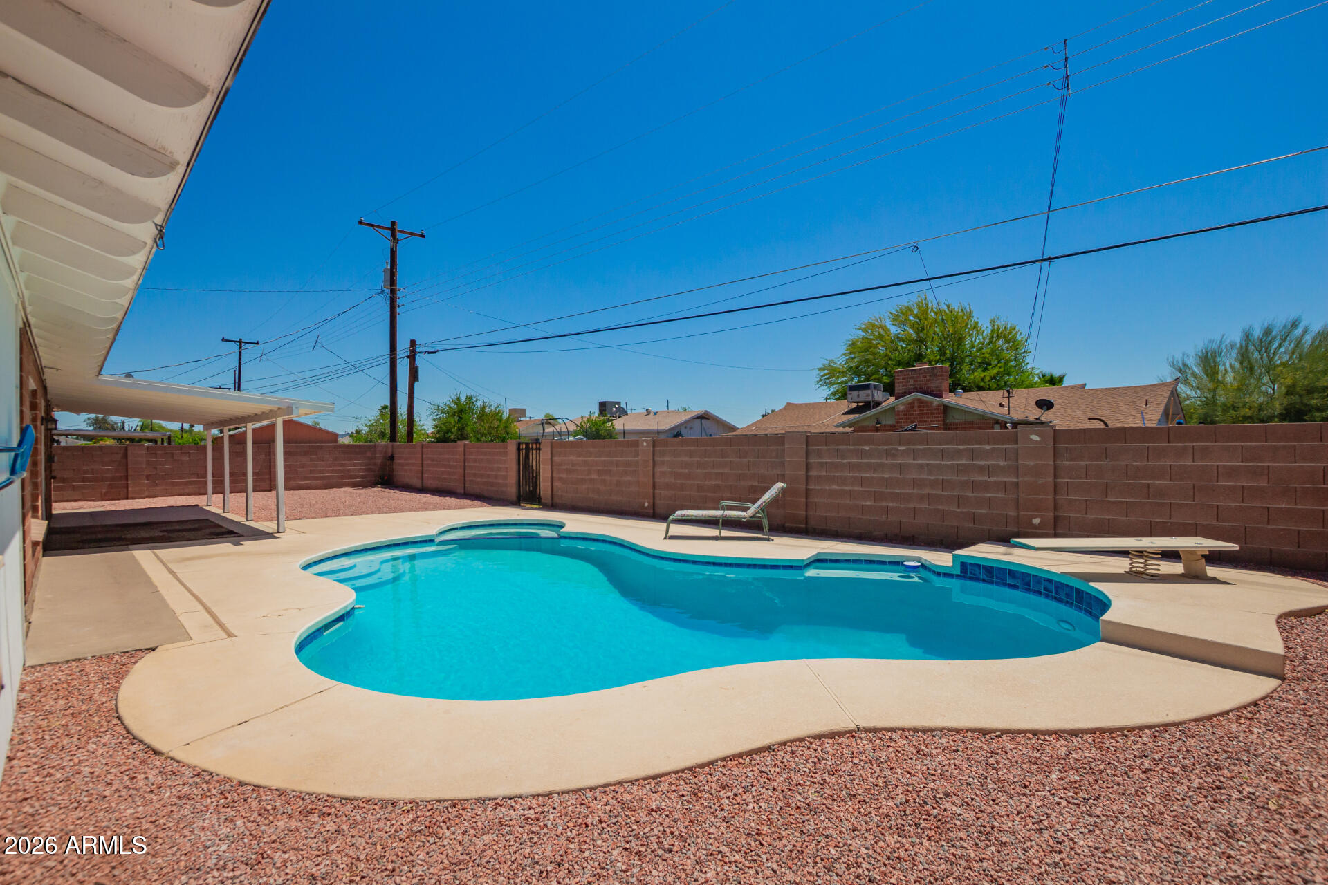 3913 West Krall Street Phoenix, AZ 85019 - Photo 30 of 35 a view of a swimming pool with a yard