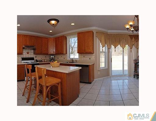 3 Stratton Road Old Bridge, NJ 07747 - Photo 6 of 10 a open kitchen with stainless steel appliances granite countertop a sink window and cabinets