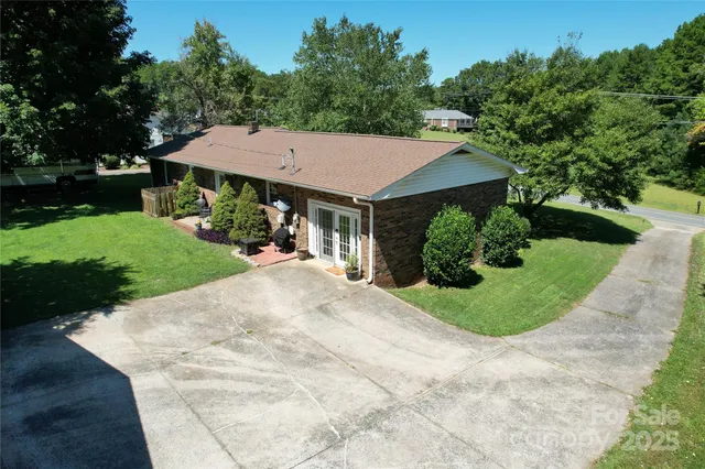 a view of a backyard with a garden and plants