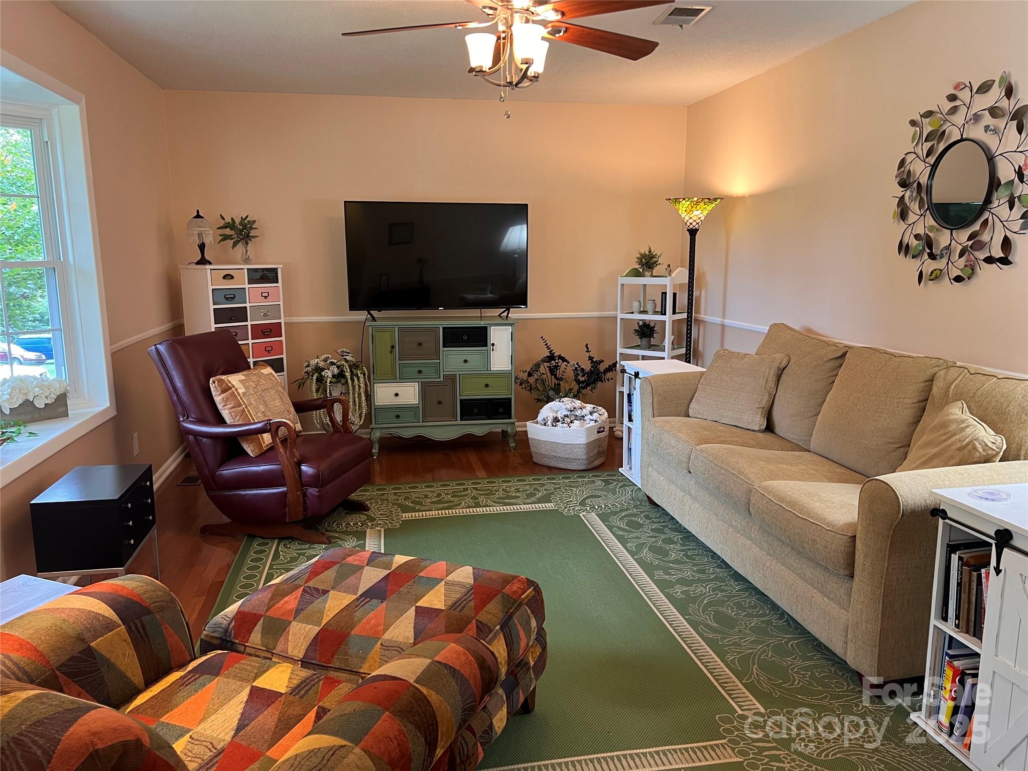 38430 Airport Road Albemarle, NC 28001 - Photo 14 of 39 a living room with furniture and a flat screen tv