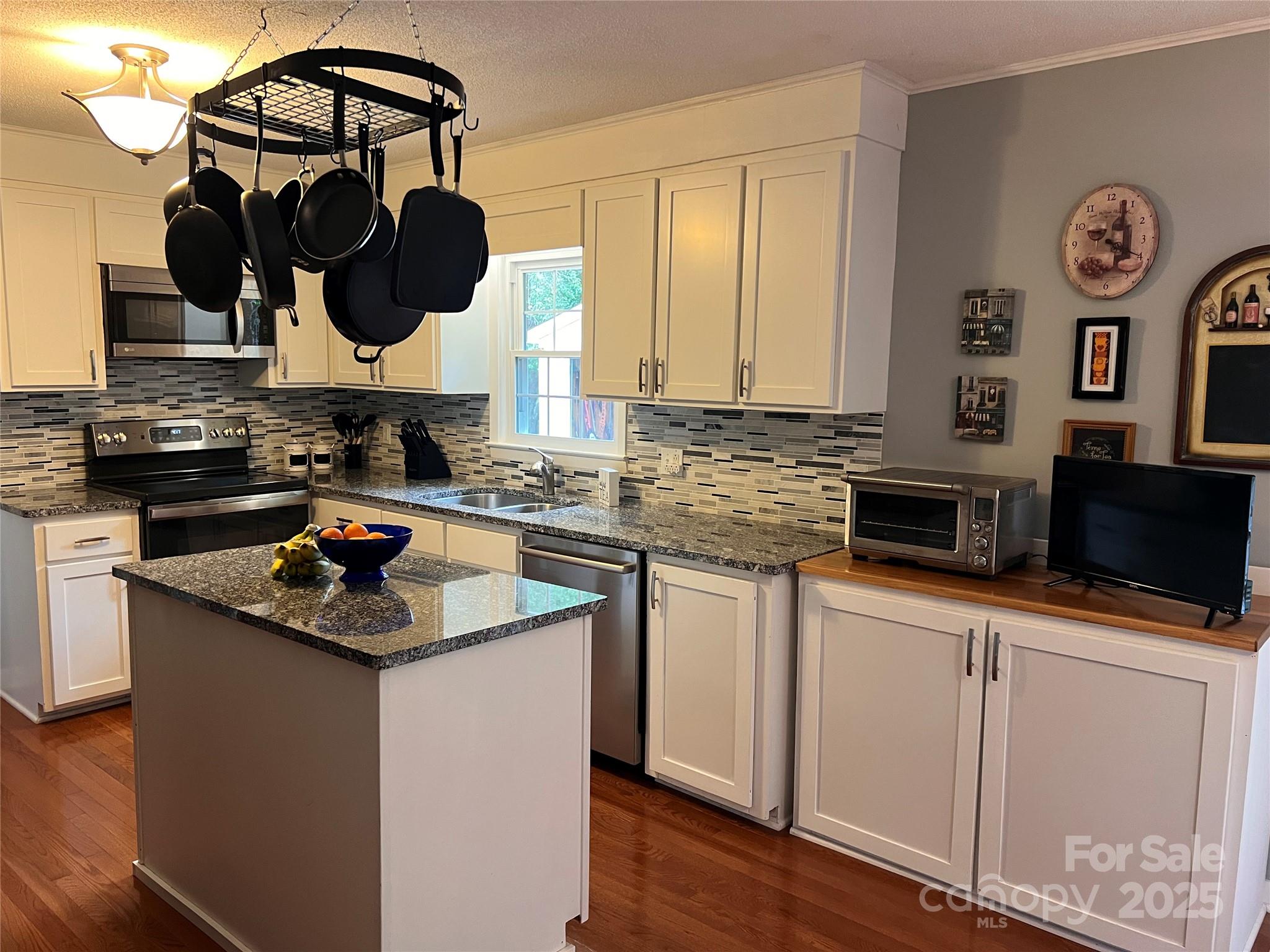 38430 Airport Road Albemarle, NC 28001 - Photo 20 of 39 a kitchen with stainless steel appliances granite countertop a sink stove and cabinets