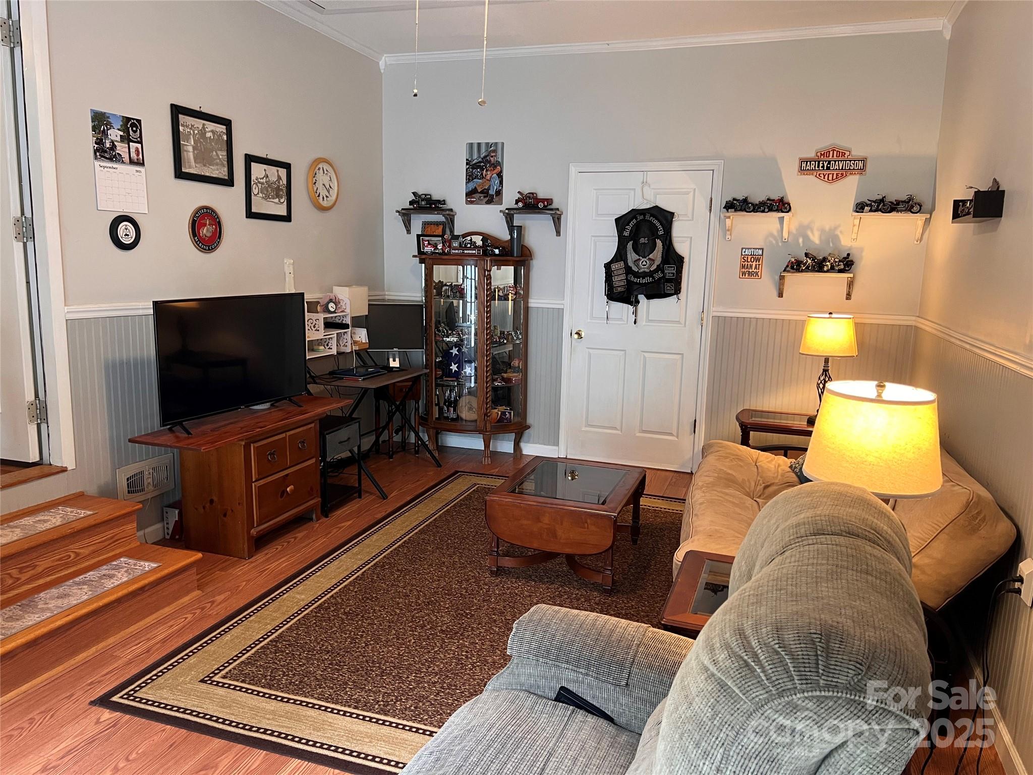 38430 Airport Road Albemarle, NC 28001 - Photo 24 of 39 a living room with furniture and a flat screen tv
