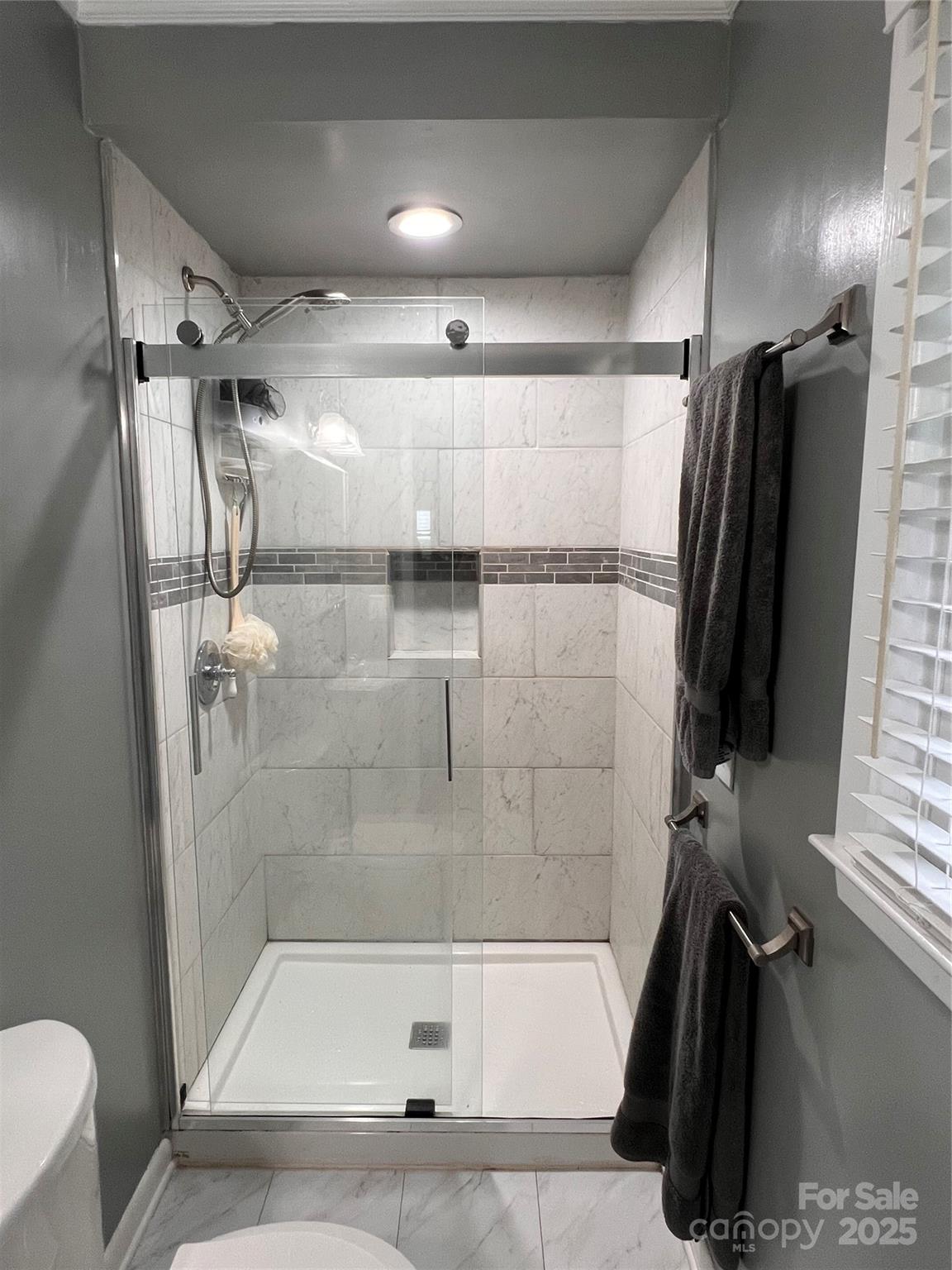 38430 Airport Road Albemarle, NC 28001 - Photo 29 of 39 a bathroom with a shower and a tub