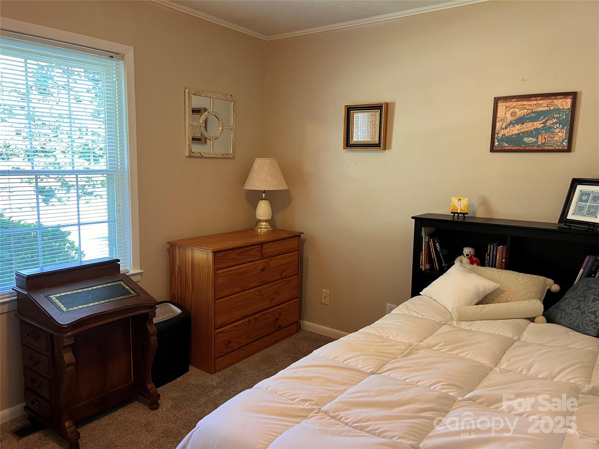38430 Airport Road Albemarle, NC 28001 - Photo 33 of 39 a bedroom with a bed and a window