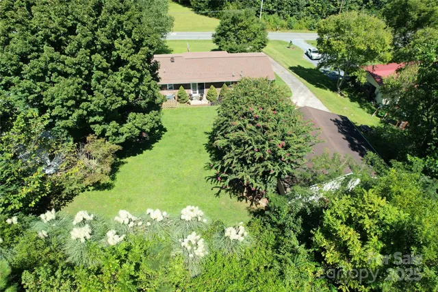 a view of a garden with a house