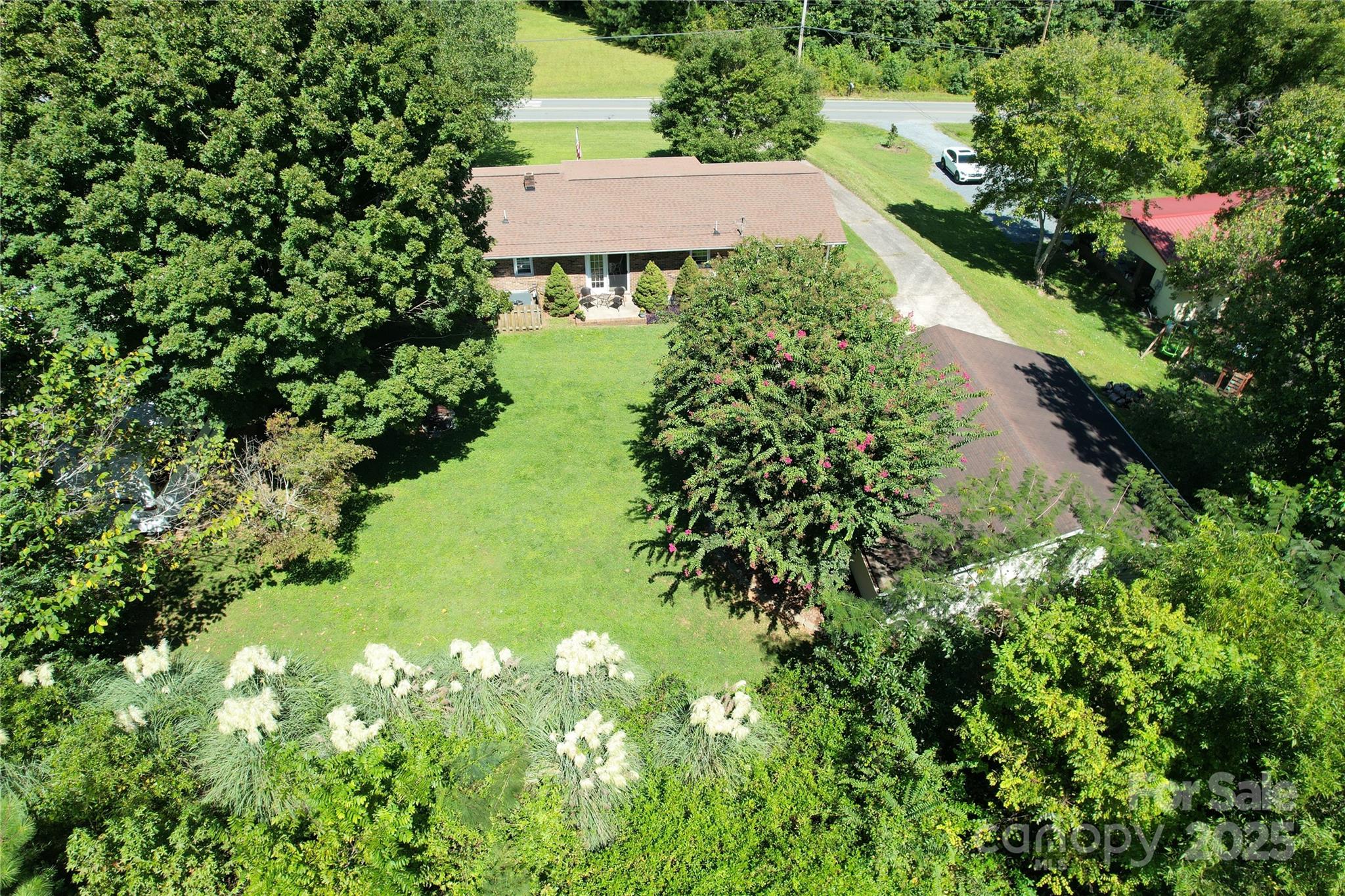 38430 Airport Road Albemarle, NC 28001 - Photo 37 of 39 a view of a garden with a house