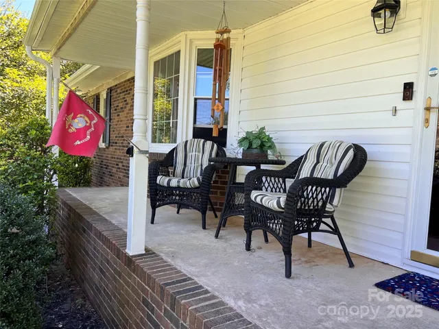 a patio with table and chairs