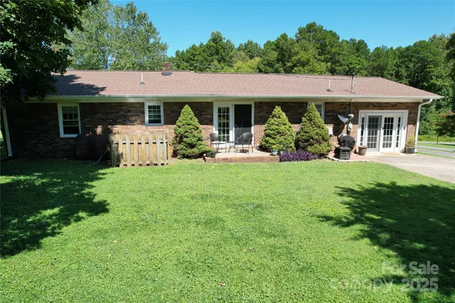 a front view of a house with garden and porch