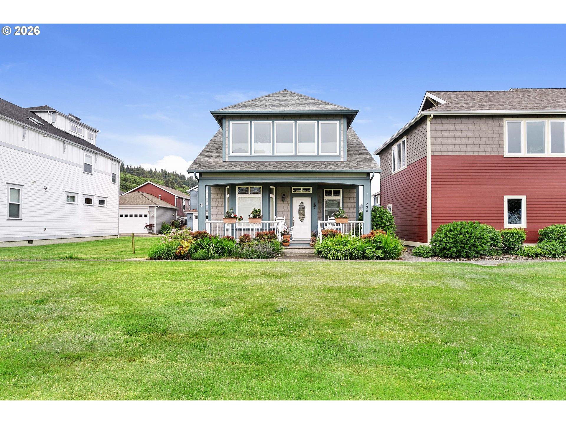 230 Round House Road Astoria, OR 97103 - Photo 1 of 43 a view of a big house with a big yard and large trees