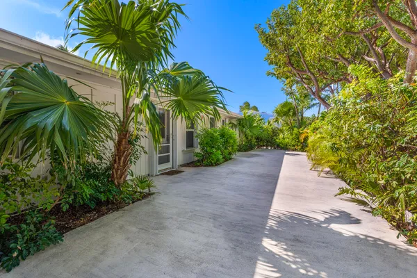 a kitchen with stainless steel appliances a refrigerator sink and microwave