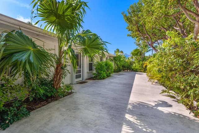 a kitchen with stainless steel appliances a refrigerator sink and microwave