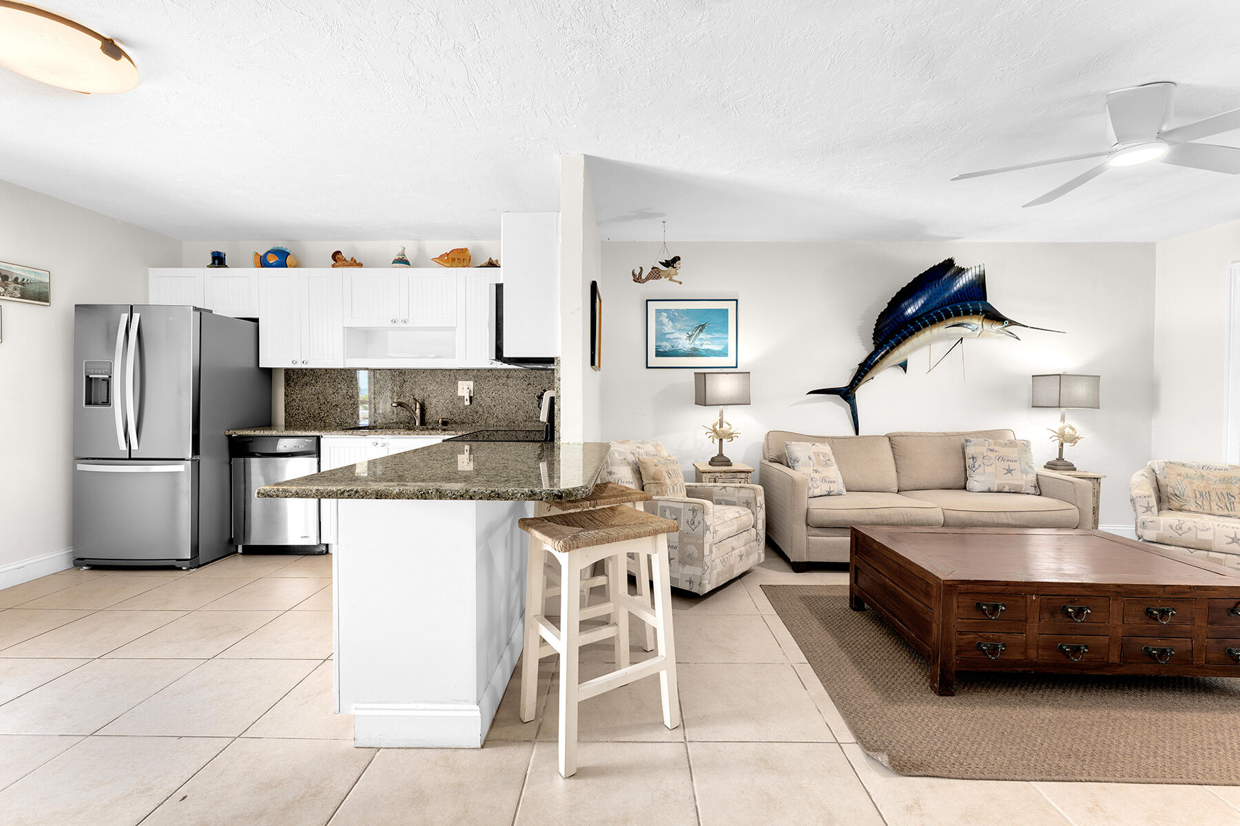 65620 Overseas Highway Long Key, FL 33001 - Photo 23 of 65 a living room with stainless steel appliances furniture a rug and a kitchen view