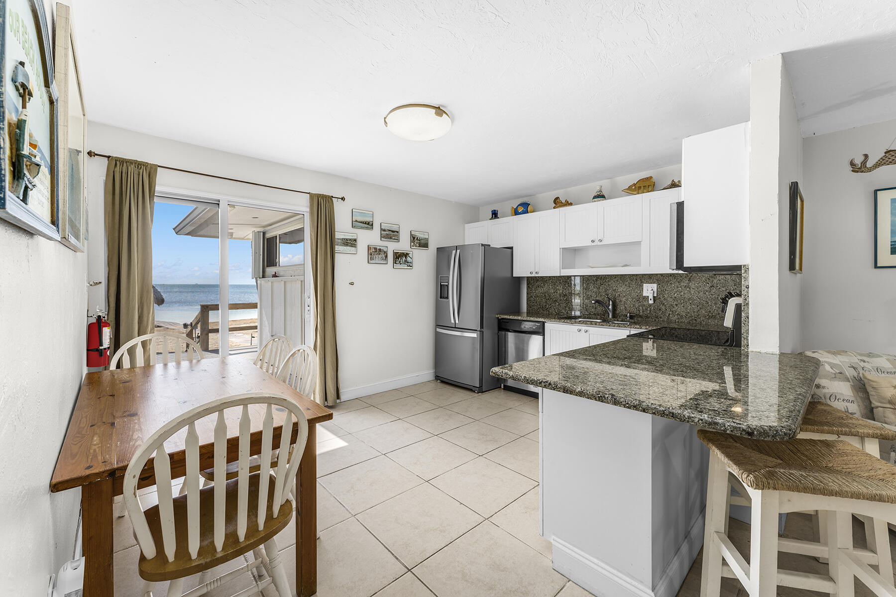 65620 Overseas Highway Long Key, FL 33001 - Photo 24 of 65 a kitchen with stainless steel appliances granite countertop a sink refrigerator and cabinets
