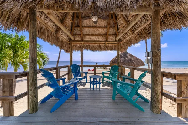 a kitchen with stainless steel appliances kitchen island granite countertop a stove a sink and a microwave