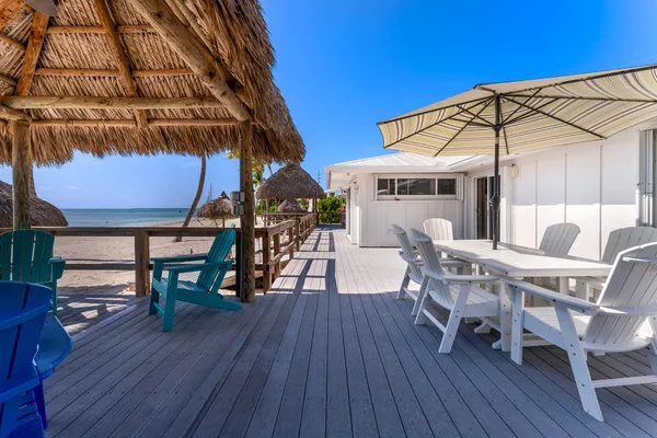 a kitchen with stainless steel appliances granite countertop a refrigerator stove a sink and dishwasher with white cabinets