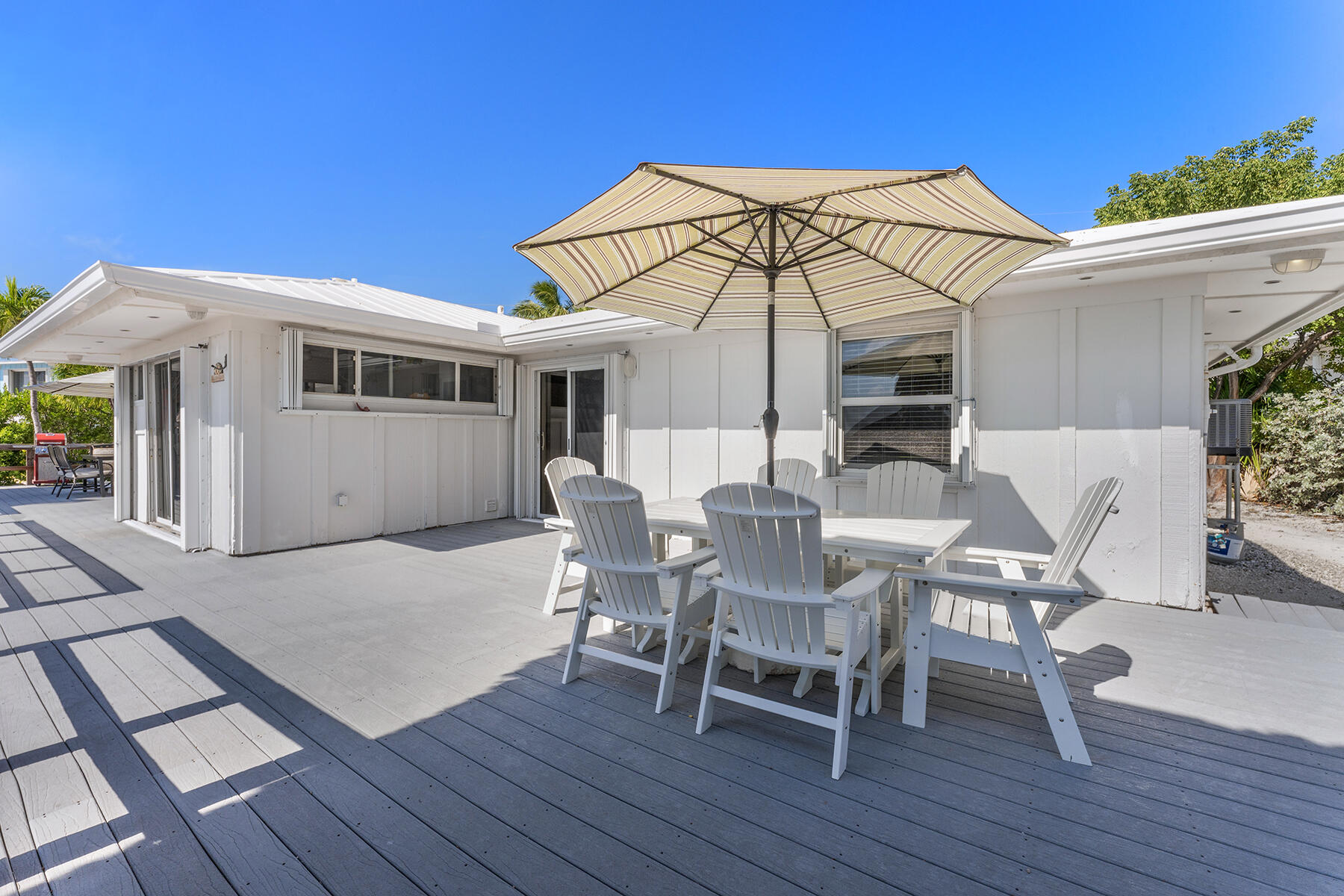 65620 Overseas Highway Long Key, FL 33001 - Photo 35 of 65 a view of a house with a patio and a yard