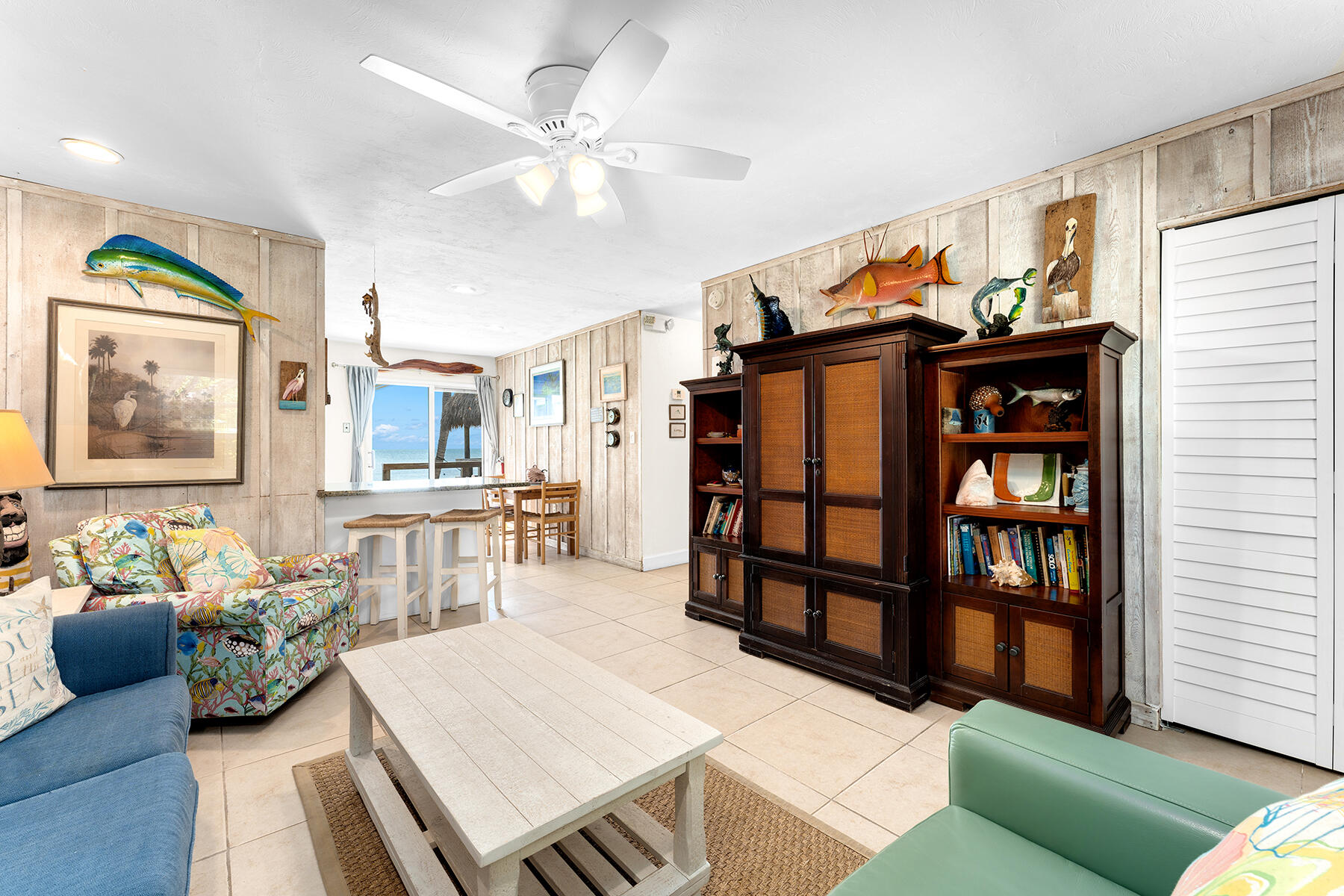 65620 Overseas Highway Long Key, FL 33001 - Photo 41 of 65 a living room with furniture a rug and a bookshelf