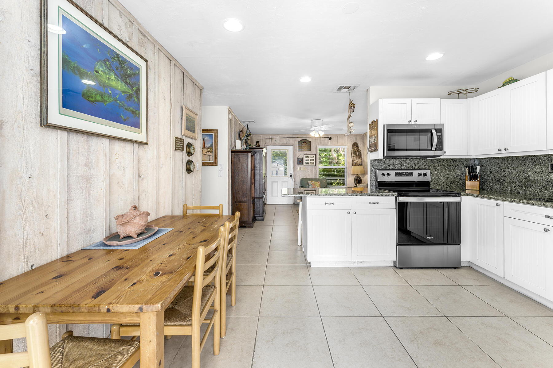 65620 Overseas Highway Long Key, FL 33001 - Photo 42 of 65 a kitchen with stainless steel appliances kitchen island granite countertop a stove a sink and a microwave