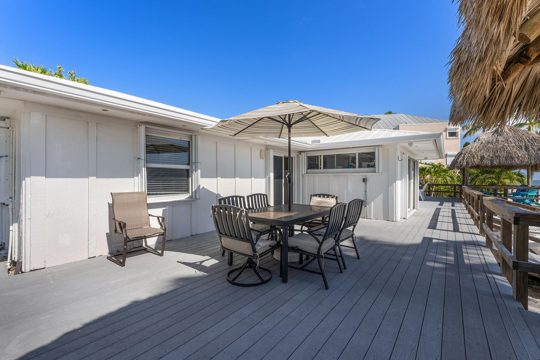 65620 Overseas Highway Long Key, FL 33001 - Photo 52 of 65 a patio with wooden floor table and chairs