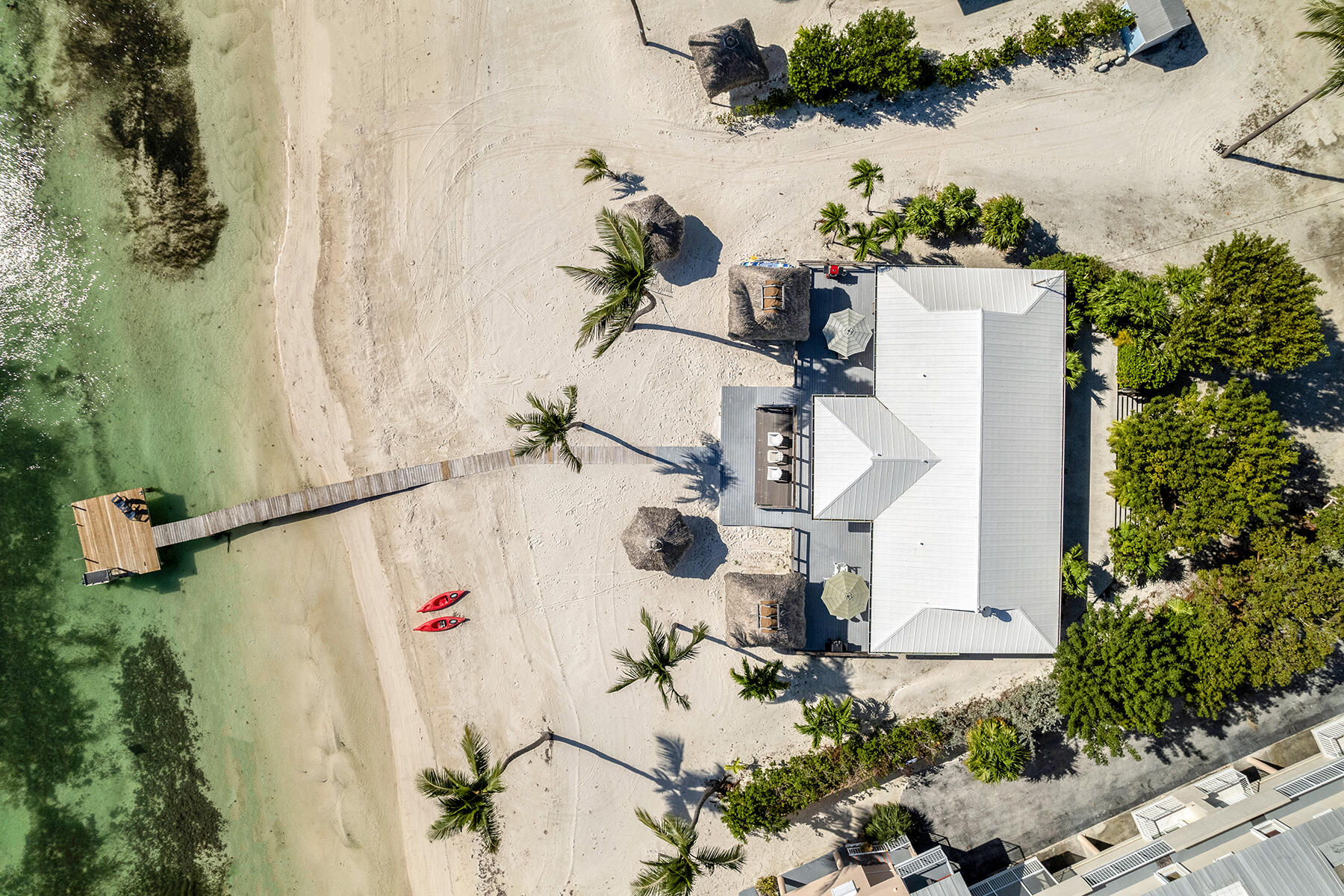 65620 Overseas Highway Long Key, FL 33001 - Photo 9 of 65 an aerial view of a house with a yard and a wooden fence