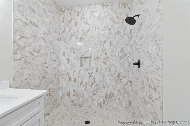 a bathroom with a sink and mirror