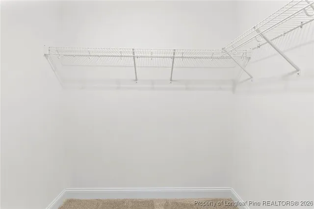 a bathroom with a toilet a sink a mirror and vanity