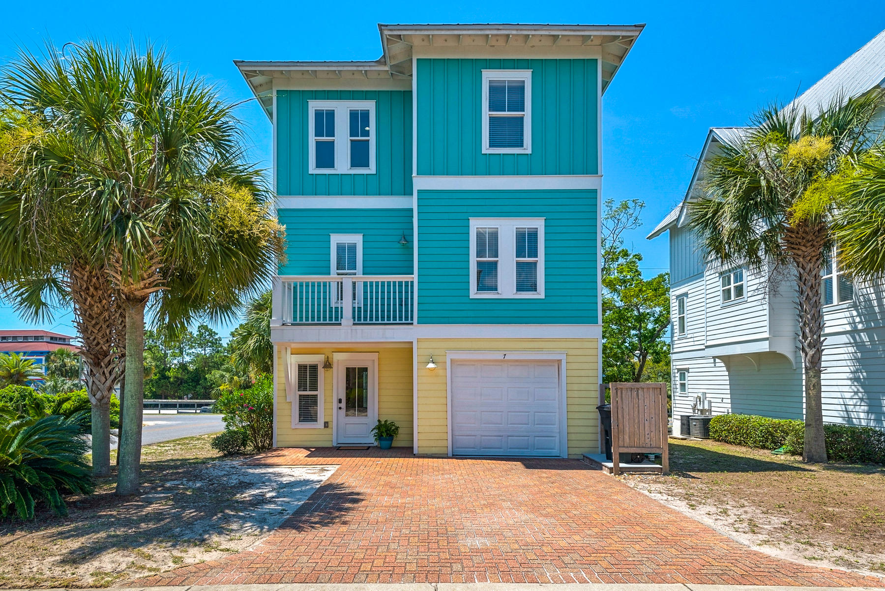 7 Seaspring Cove Santa Rosa Beach, FL 32459 - Photo 1 of 46 a front view of a house with a yard and garage
