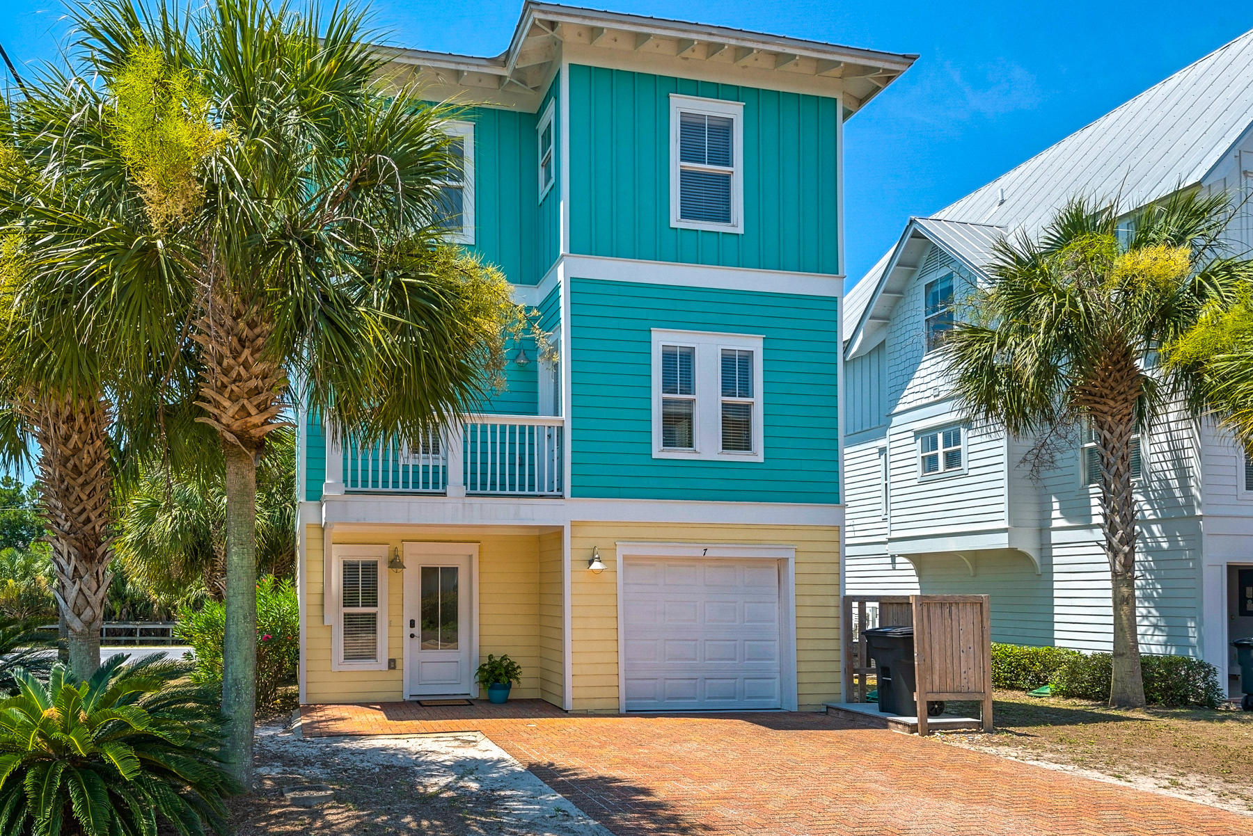 7 Seaspring Cove Santa Rosa Beach, FL 32459 - Photo 2 of 46 a front view of a house with a yard and garage