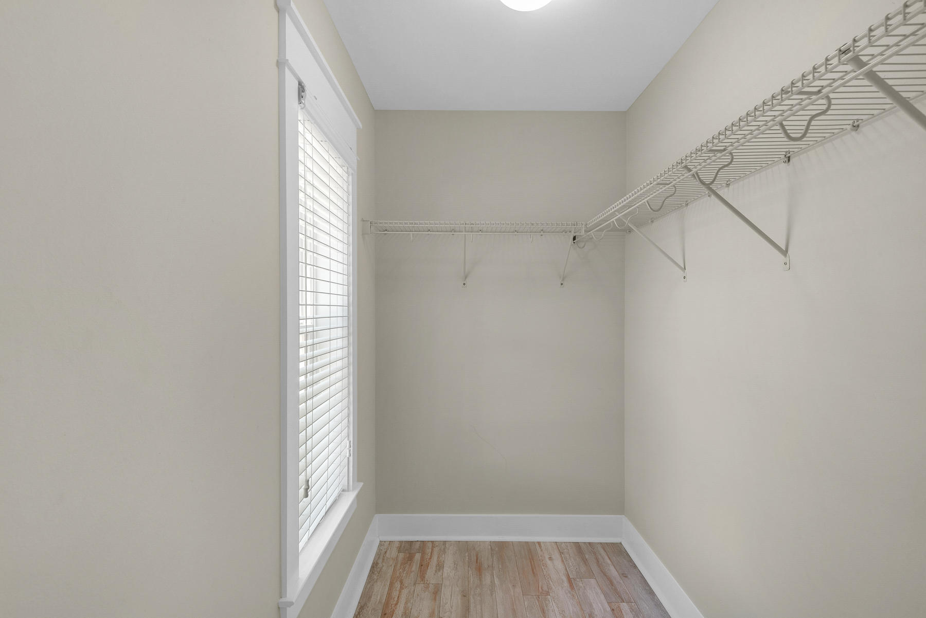 7 Seaspring Cove Santa Rosa Beach, FL 32459 - Photo 14 of 46 a view of a room with racks on the wall