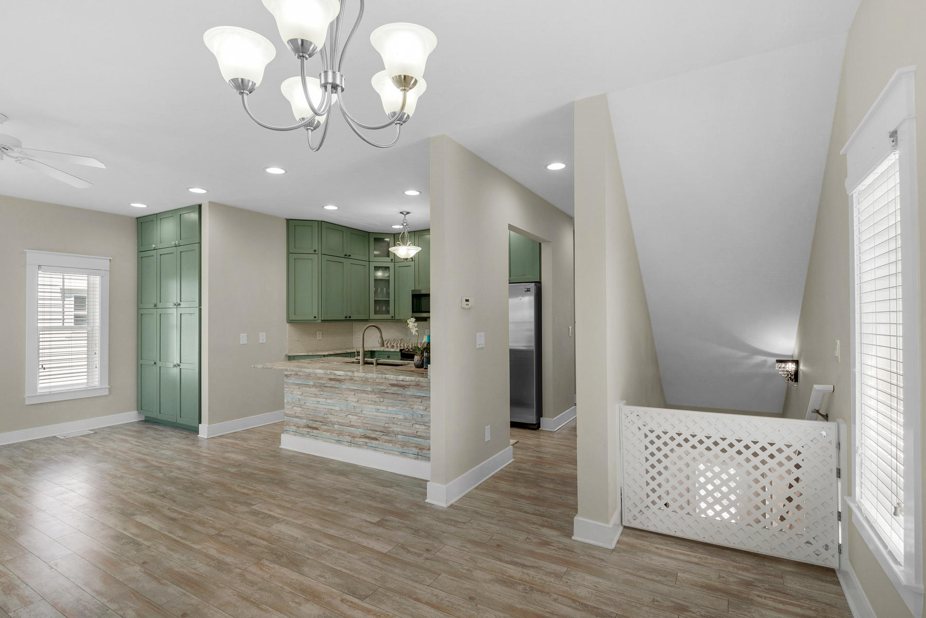 7 Seaspring Cove Santa Rosa Beach, FL 32459 - Photo 15 of 46 a view of a hallway with wooden floor and chandelier