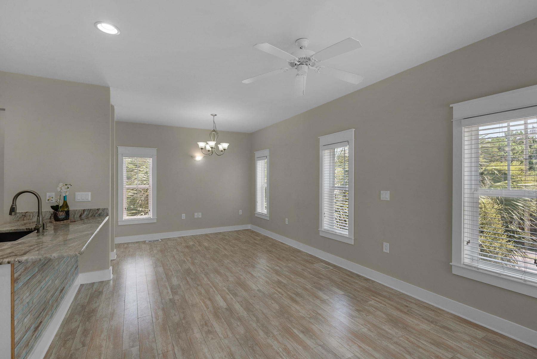 7 Seaspring Cove Santa Rosa Beach, FL 32459 - Photo 18 of 46 a view of an empty room with window and wooden floor
