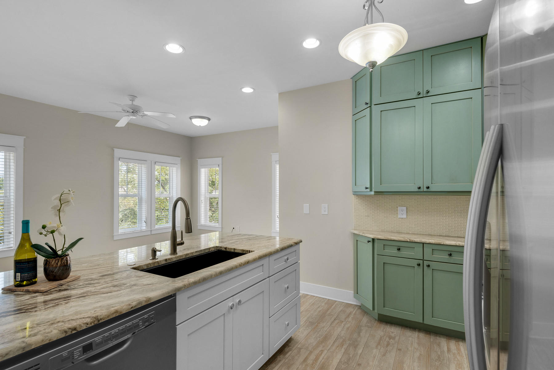 7 Seaspring Cove Santa Rosa Beach, FL 32459 - Photo 22 of 46 a kitchen with stainless steel appliances granite countertop a sink and a refrigerator