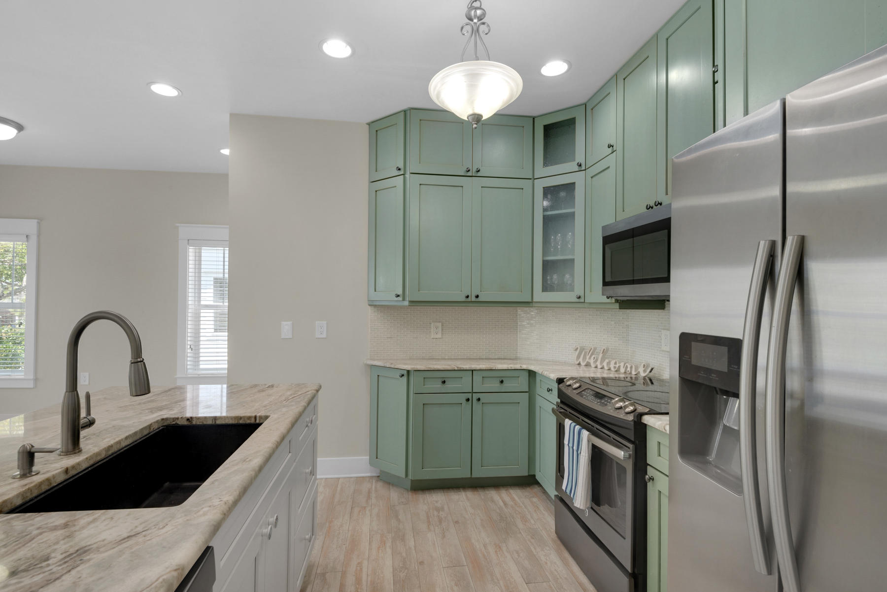 7 Seaspring Cove Santa Rosa Beach, FL 32459 - Photo 23 of 46 a kitchen with cabinets a sink and stainless steel appliances