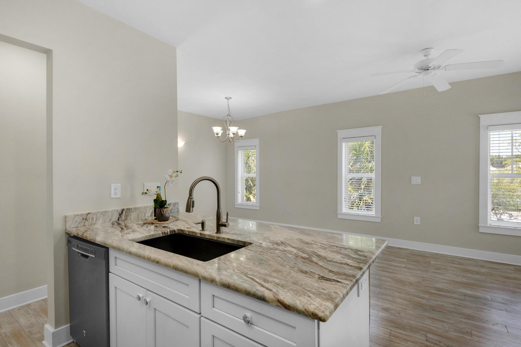 7 Seaspring Cove Santa Rosa Beach, FL 32459 - Photo 24 of 46 a kitchen with granite countertop a sink white cabinets and window
