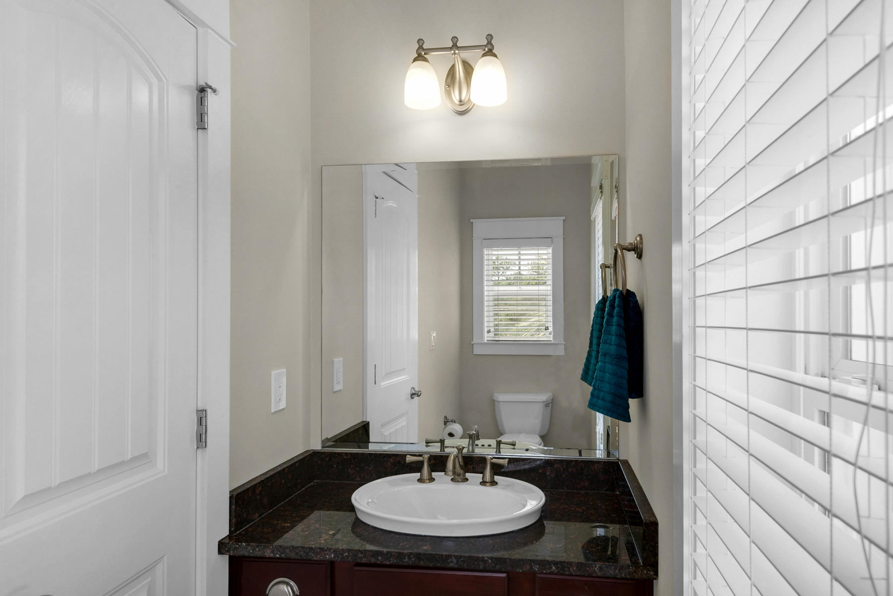 7 Seaspring Cove Santa Rosa Beach, FL 32459 - Photo 26 of 46 a bathroom with a sink and a mirror